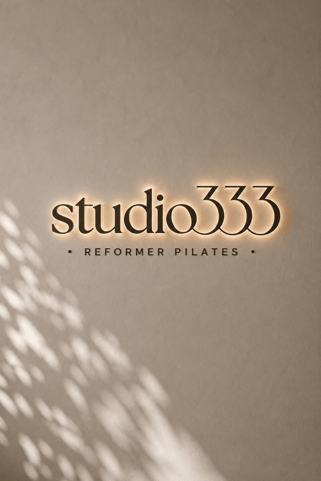 Studio 333 wall signage with warm backlighting